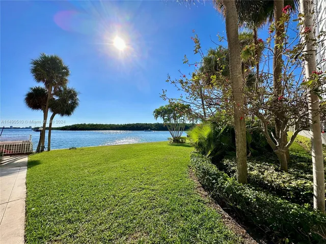a view of outdoor space with lots of swings and slides