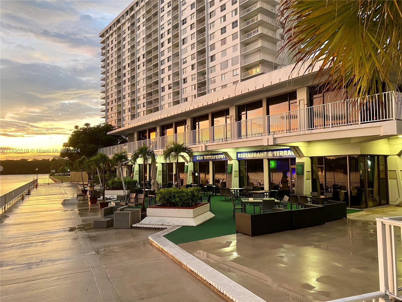 500 Bayview Drive, Unit 221 Sunny Isles Beach, FL 33160 - Photo 26 of 35 a view of outdoor space with lots of swings and slides