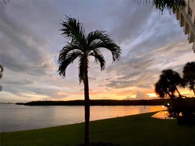 a view of swimming pool with a table and chairs