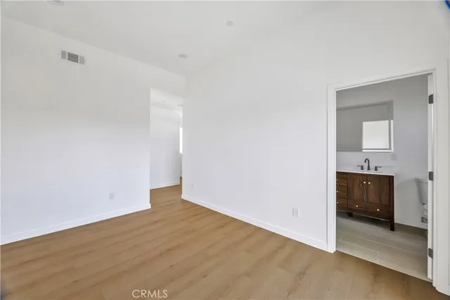 a kitchen with cabinets appliances a sink and a counter top space