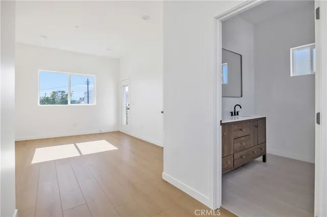 a view of an entryway with wooden floor