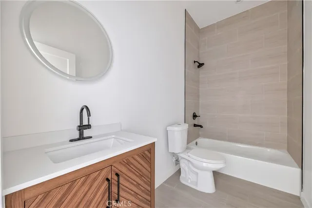 a kitchen with cabinets appliances a sink and a counter top space