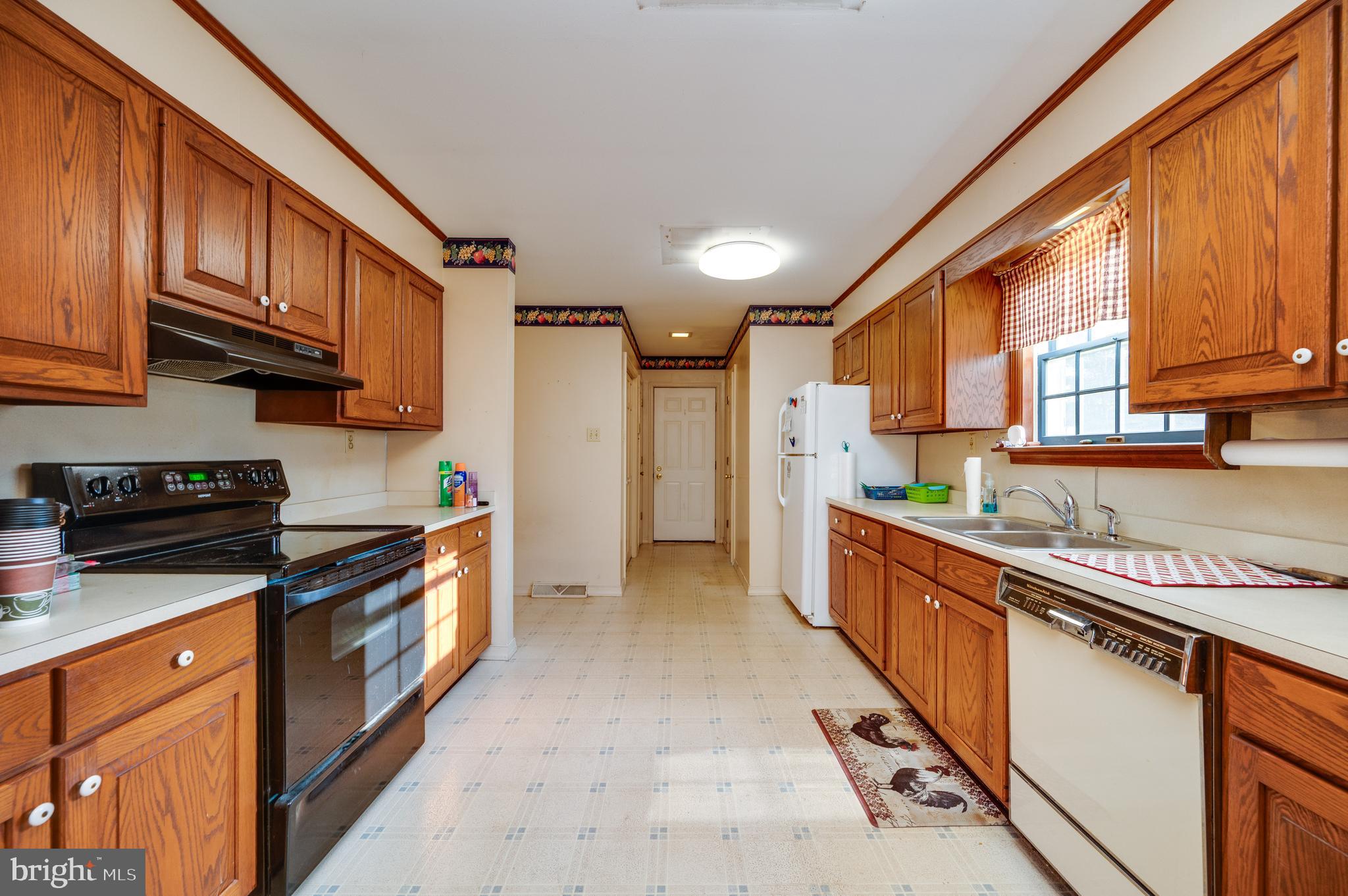 730 Texter Mountain Road Robesonia, PA 19551 - Photo 17 of 58 a large kitchen with stainless steel appliances granite countertop a stove a sink and a refrigerator