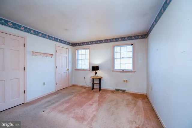 a view of empty room with windows