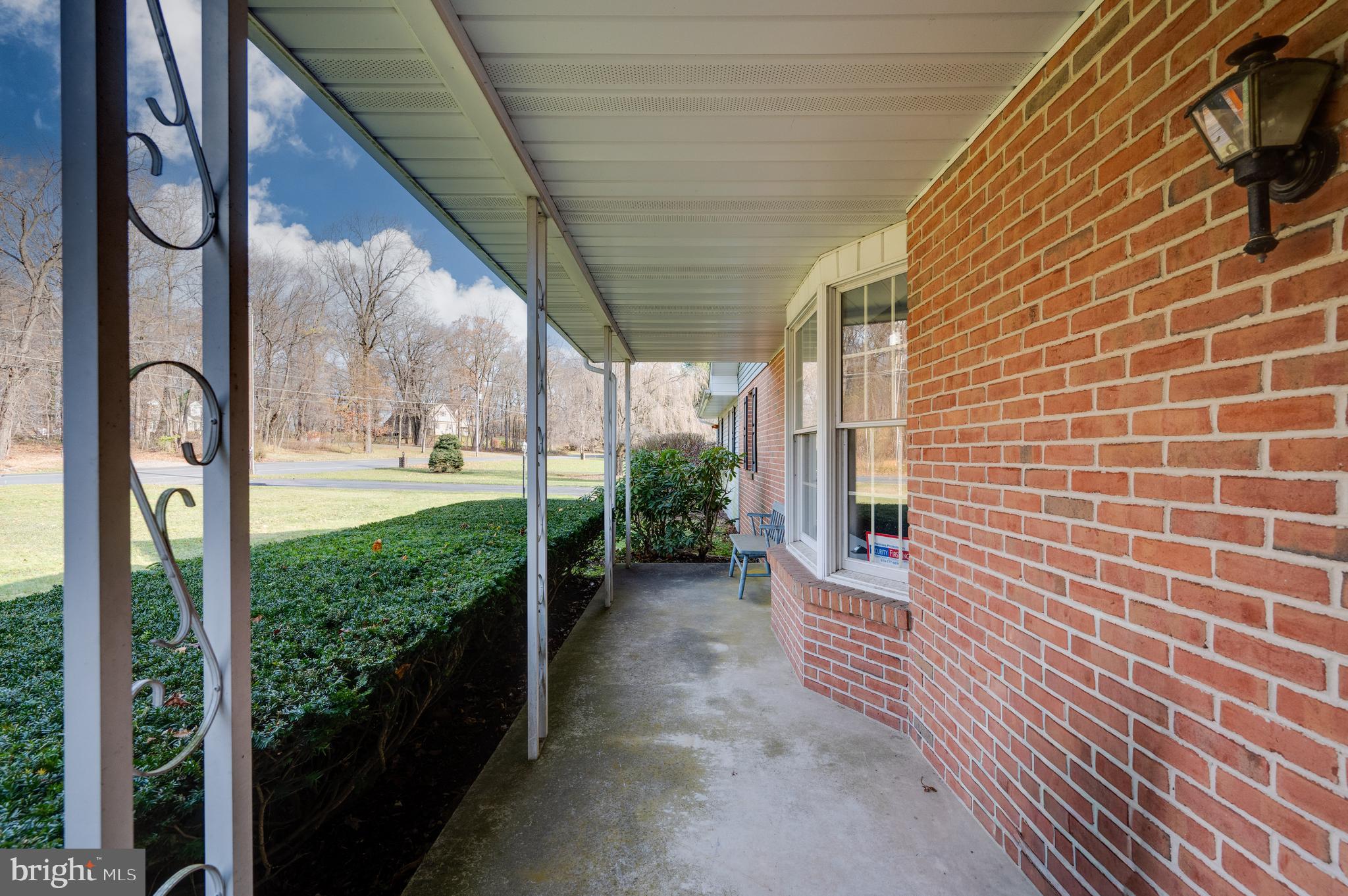 730 Texter Mountain Road Robesonia, PA 19551 - Photo 3 of 58 a view of a porch with a table and chairs