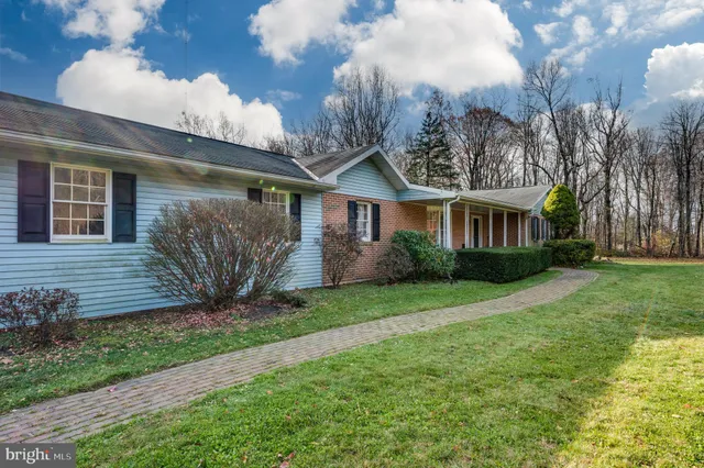 a view of a house with a big yard