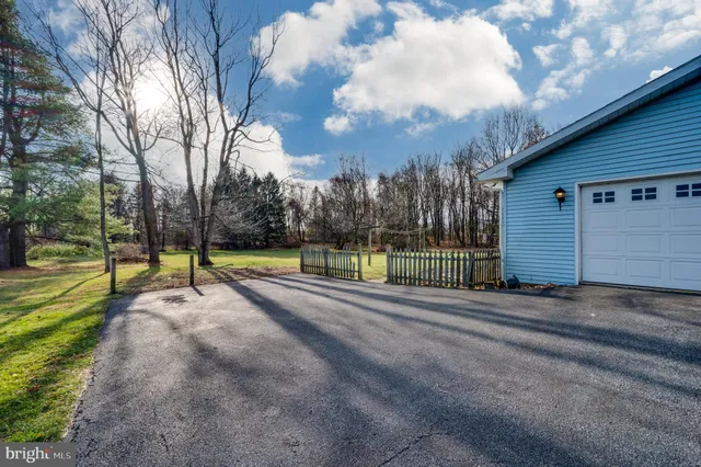 a view of a house with a big yard