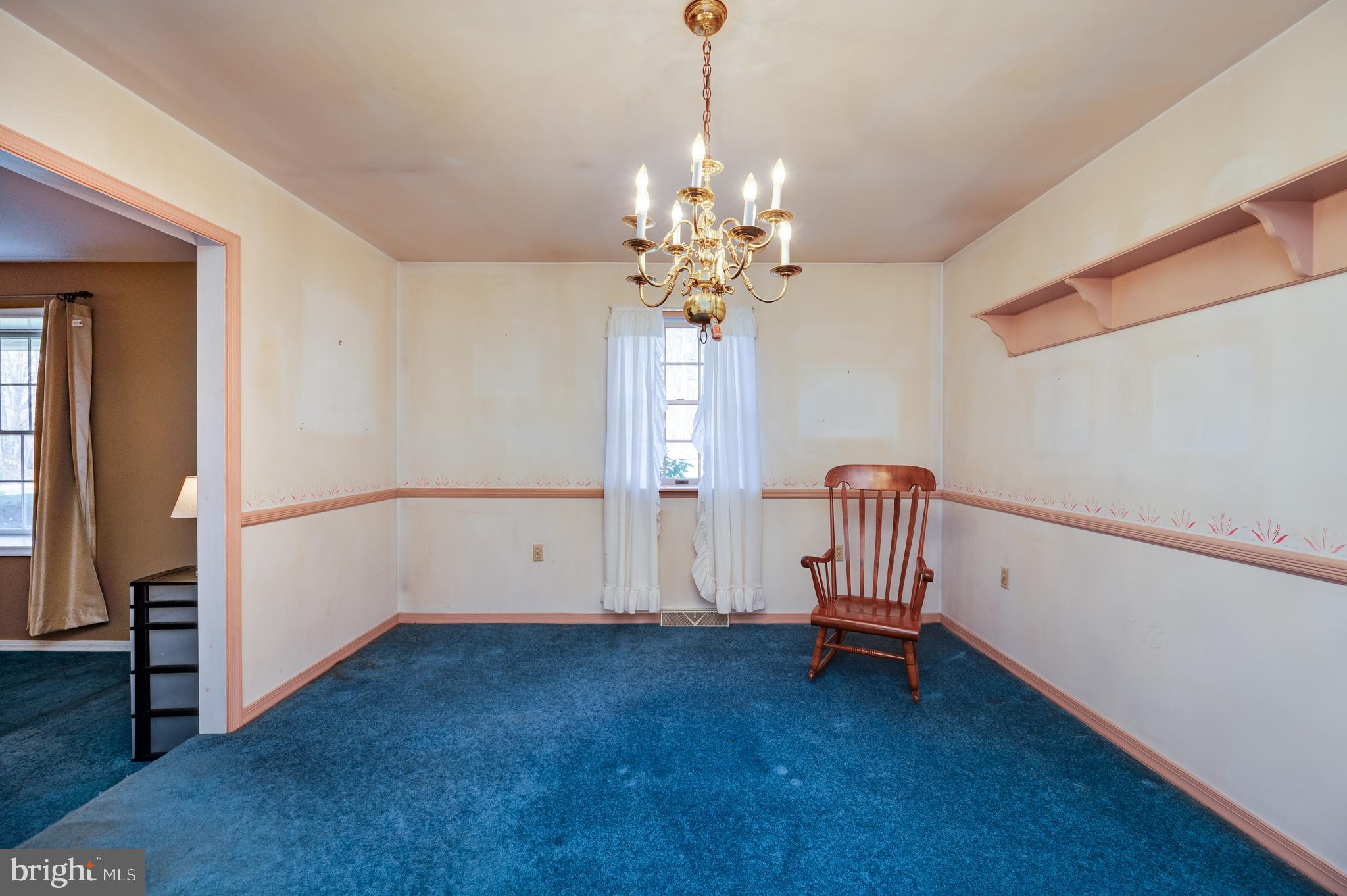 730 Texter Mountain Road Robesonia, PA 19551 - Photo 10 of 58 an empty room with stairs and wooden floor