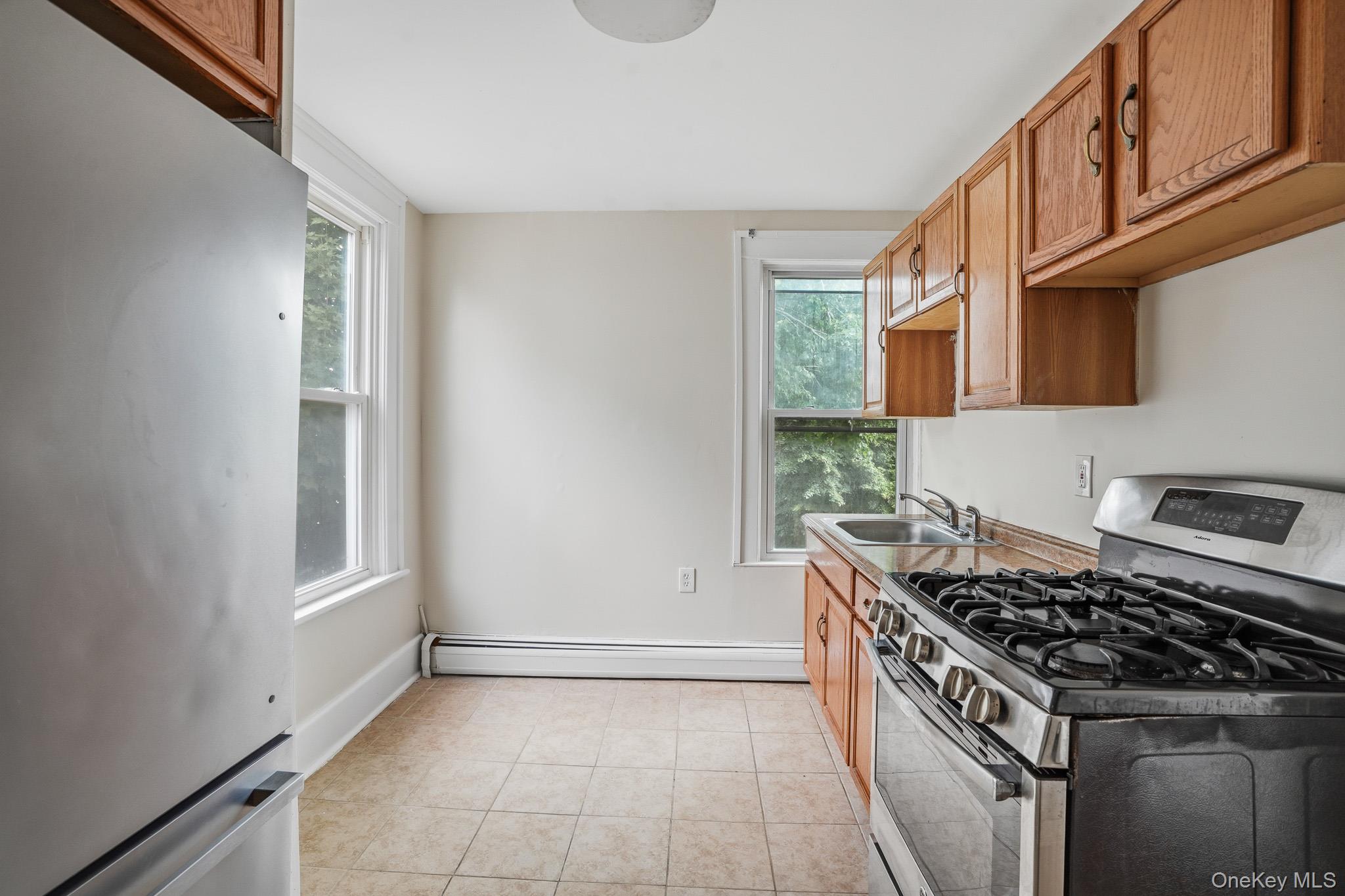 65 North Clinton Street Poughkeepsie, NY 12601 - Photo 23 of 43 a kitchen with a stove and a microwave