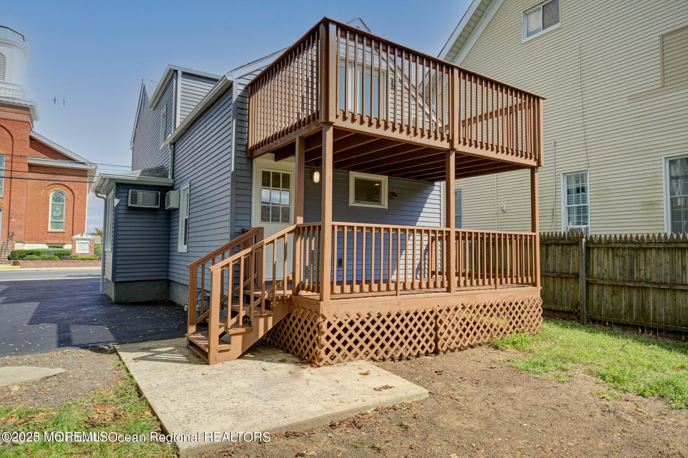 54 Main Street, Unit 2 Keyport, NJ 07735 - Photo 14 of 25 a view of a house with a wooden deck
