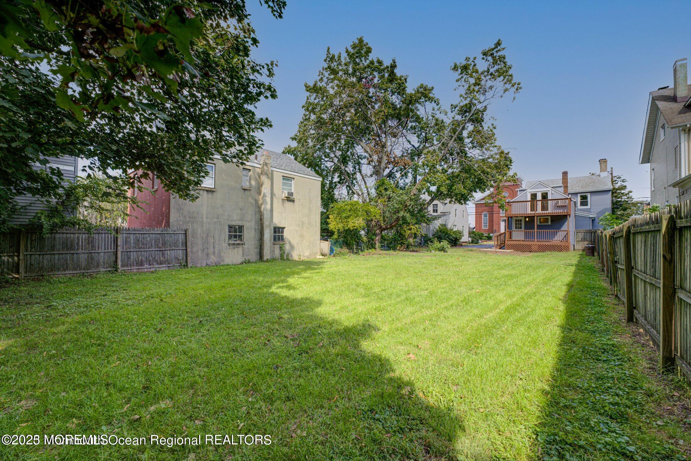 54 Main Street, Unit 2 Keyport, NJ 07735 - Photo 15 of 25 a view of a backyard with large trees