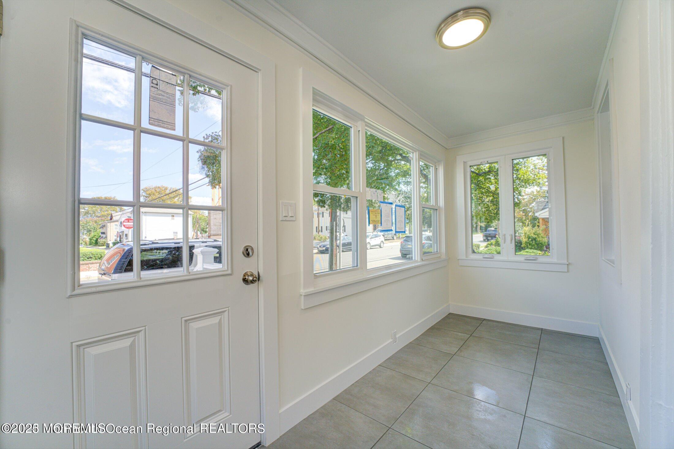 54 Main Street, Unit 2 Keyport, NJ 07735 - Photo 2 of 25 an empty room with windows