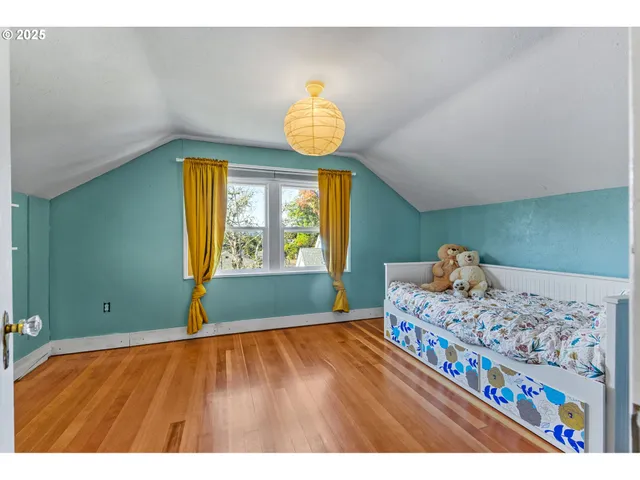 a bedroom with a bed and window