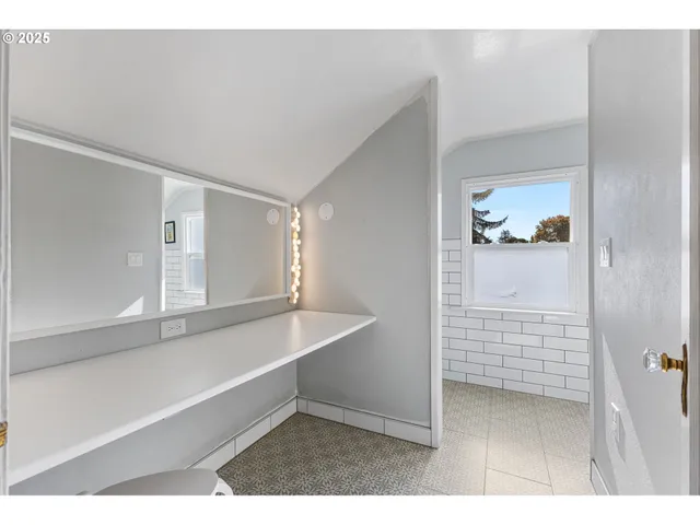 a view of walk in closet with cabinet