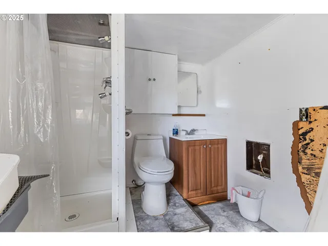 a bathroom with a toilet sink a shower and a bathtub