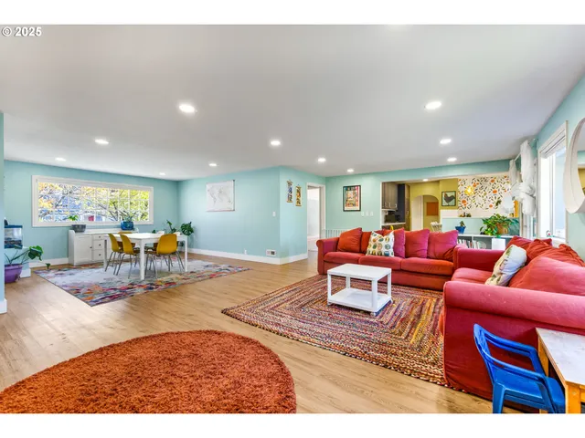 a living room with furniture and a table