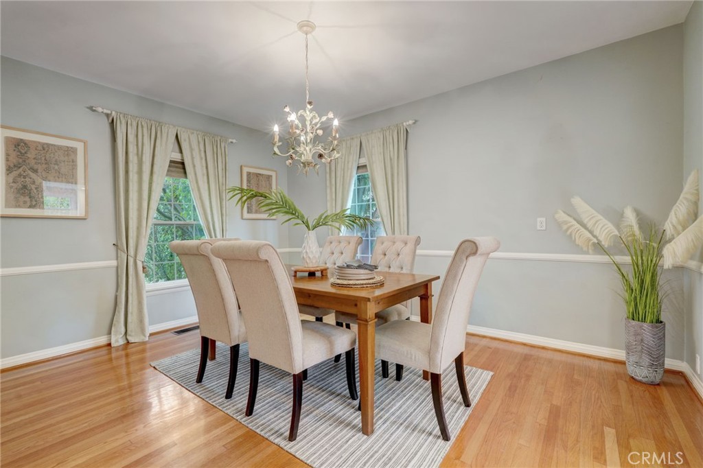 319 Longden Drive San Gabriel, CA 91775 - Photo 11 of 39 a view of a dining room with furniture a chandelier and wooden floor
