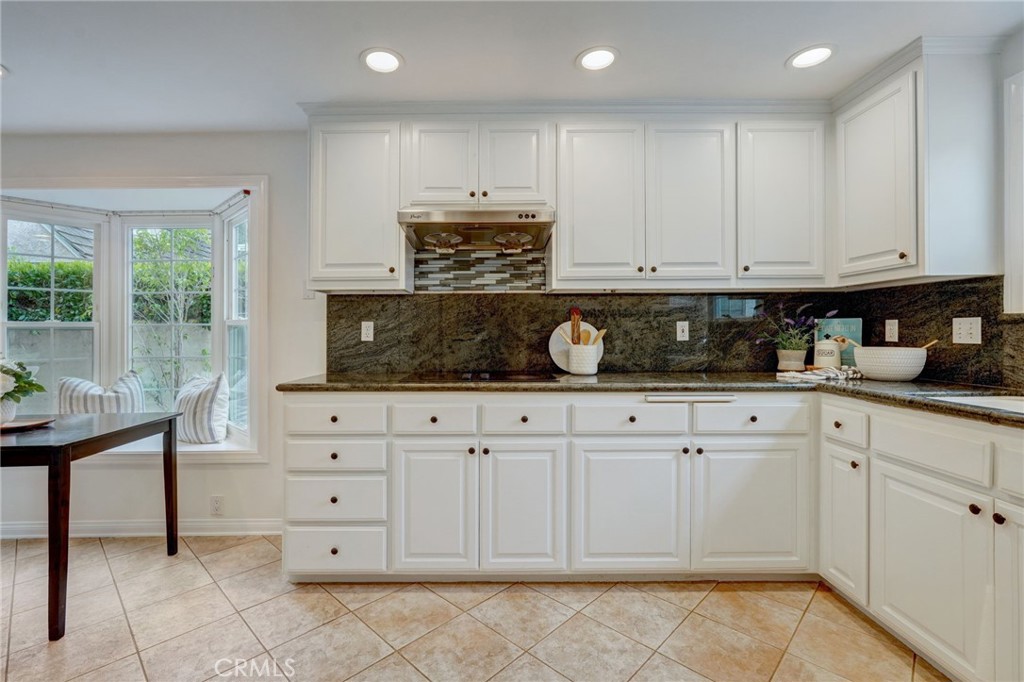 319 Longden Drive San Gabriel, CA 91775 - Photo 13 of 39 a kitchen with white cabinets and window