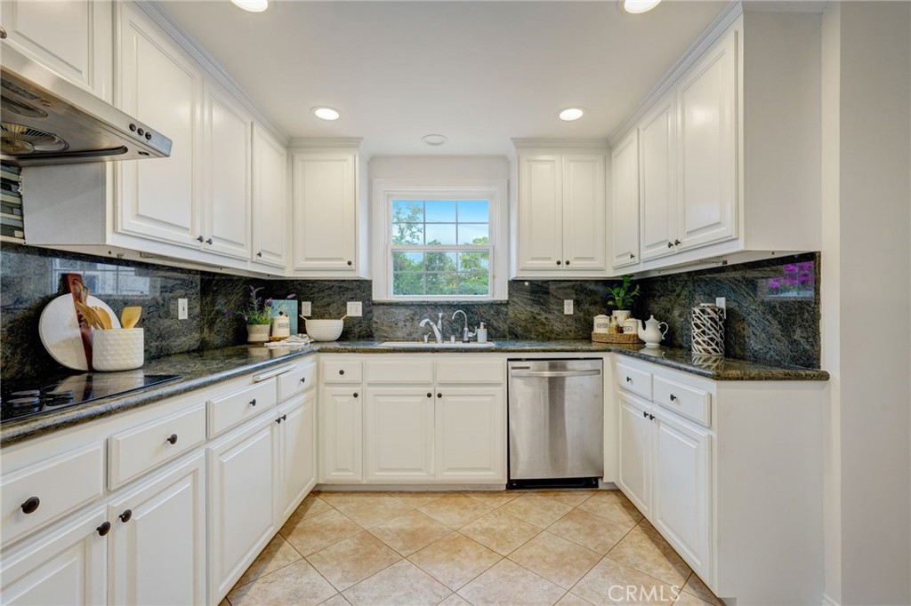 319 Longden Drive San Gabriel, CA 91775 - Photo 14 of 39 a kitchen with granite countertop white cabinets stainless steel appliances and a sink