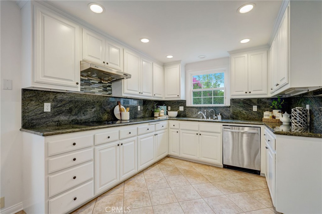 319 Longden Drive San Gabriel, CA 91775 - Photo 15 of 39 a kitchen with granite countertop white cabinets stainless steel appliances and a sink