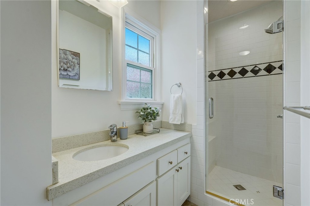 319 Longden Drive San Gabriel, CA 91775 - Photo 21 of 39 a bathroom with a sink a shower and a mirror