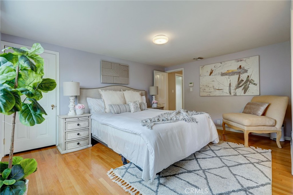 319 Longden Drive San Gabriel, CA 91775 - Photo 24 of 39 a bedroom with a bed and a potted plant