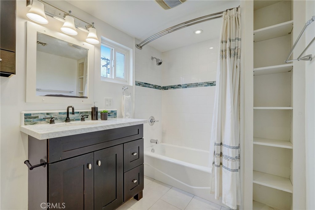 319 Longden Drive San Gabriel, CA 91775 - Photo 30 of 39 a bathroom with a bath tub sink mirror and shower