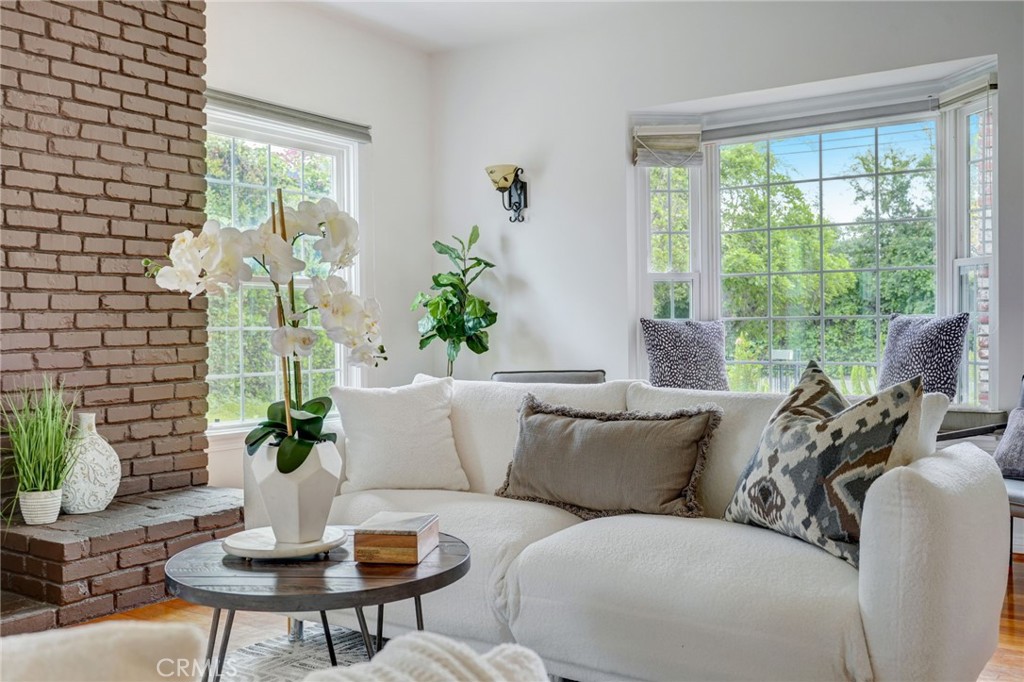319 Longden Drive San Gabriel, CA 91775 - Photo 4 of 39 a living room with furniture and a potted plant