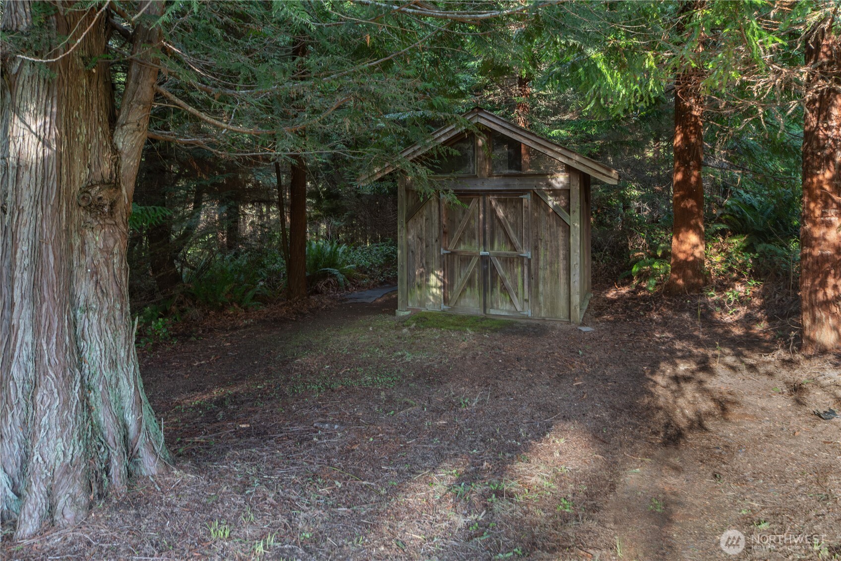 0 Olympic Ridge Drive Port Ludlow, WA 98365 - Photo 5 of 20 a wooden house with tall trees