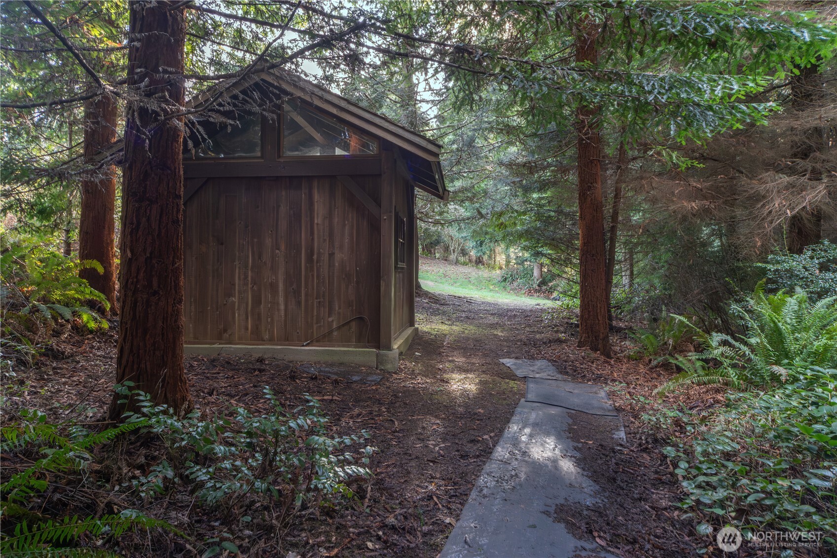 0 Olympic Ridge Drive Port Ludlow, WA 98365 - Photo 7 of 20 a view of a wooden house with large trees
