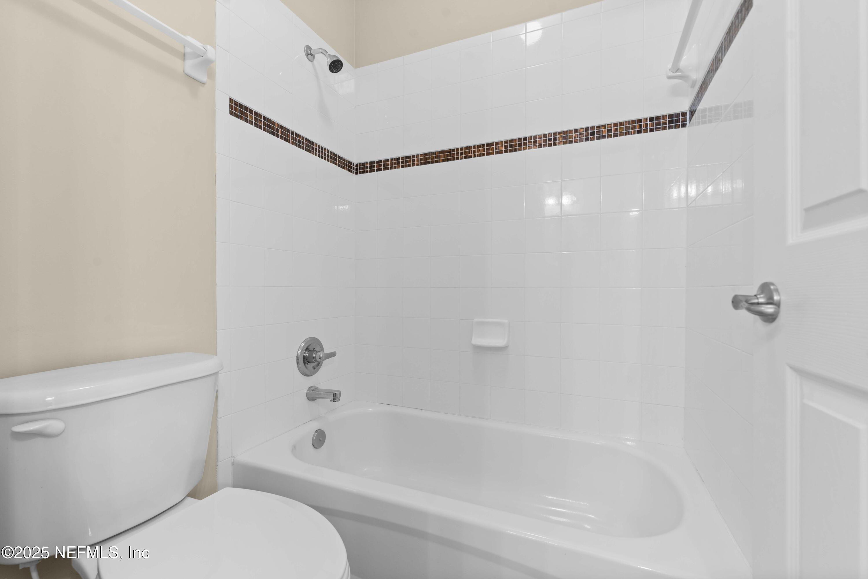 11798 Blueberry Lane Macclenny, FL 32063 - Photo 20 of 30 a bathroom with a bathtub and a shower