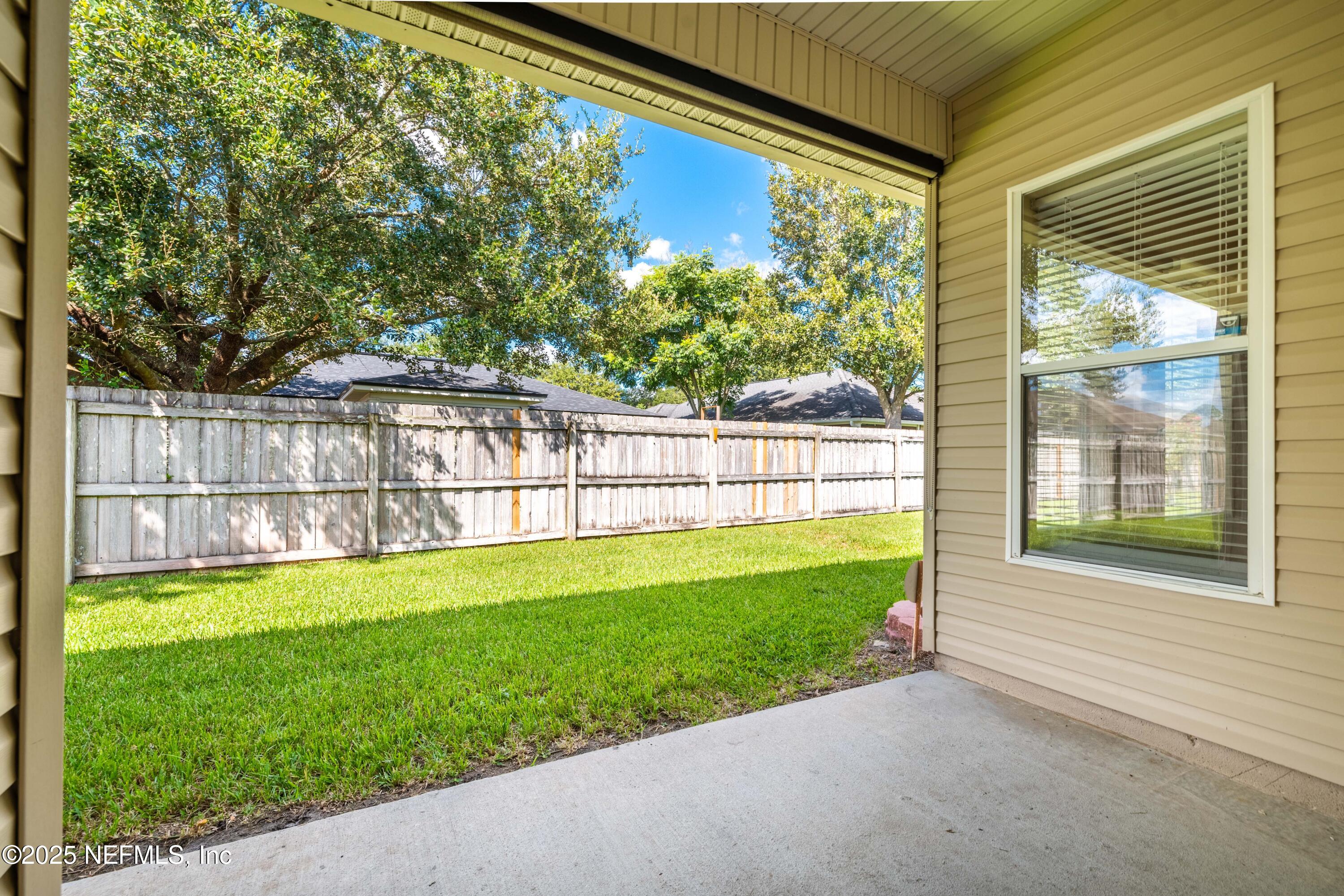 11798 Blueberry Lane Macclenny, FL 32063 - Photo 25 of 30 a view of a backyard with a garden and plants