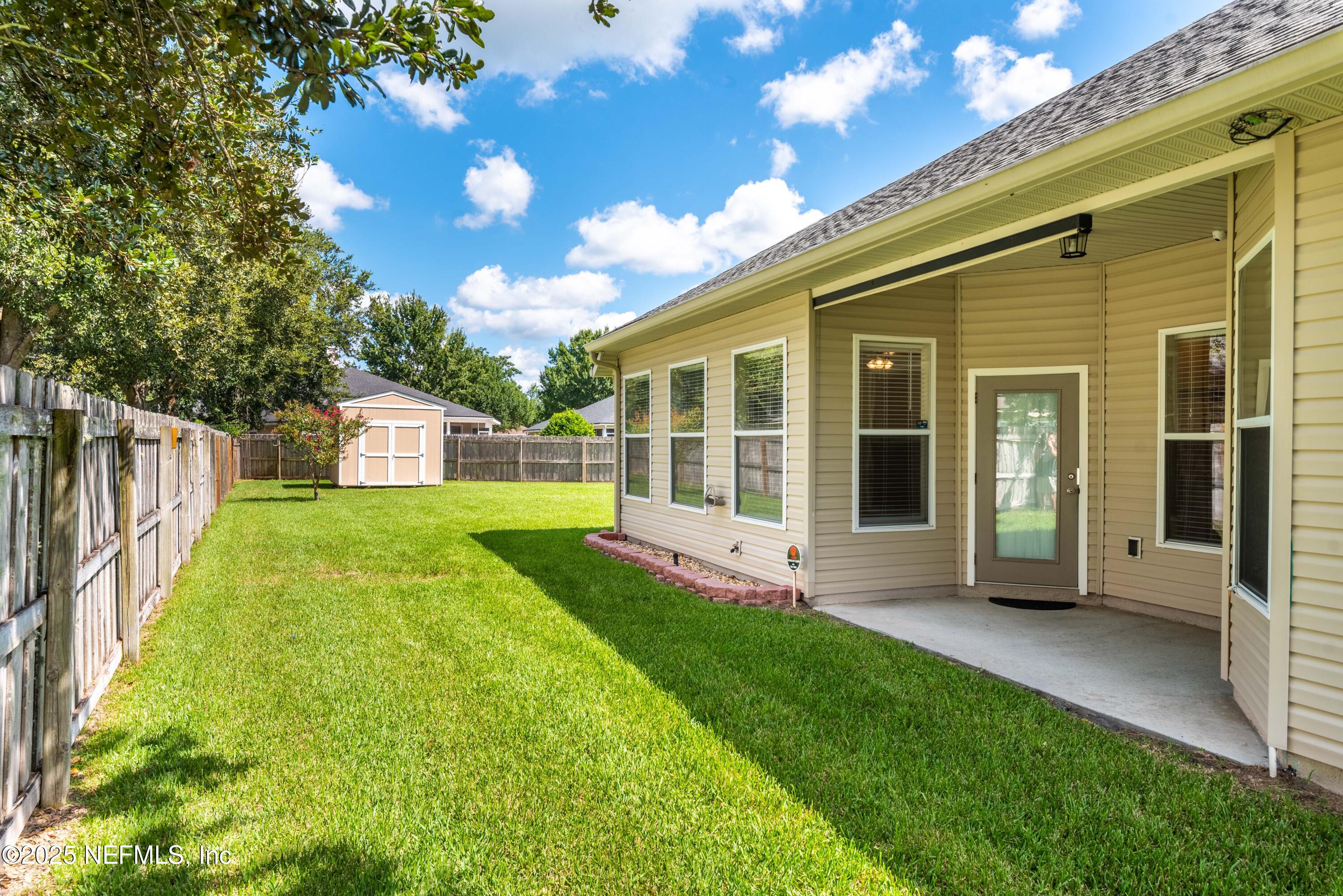 11798 Blueberry Lane Macclenny, FL 32063 - Photo 26 of 30 a view of a house with backyard and porch