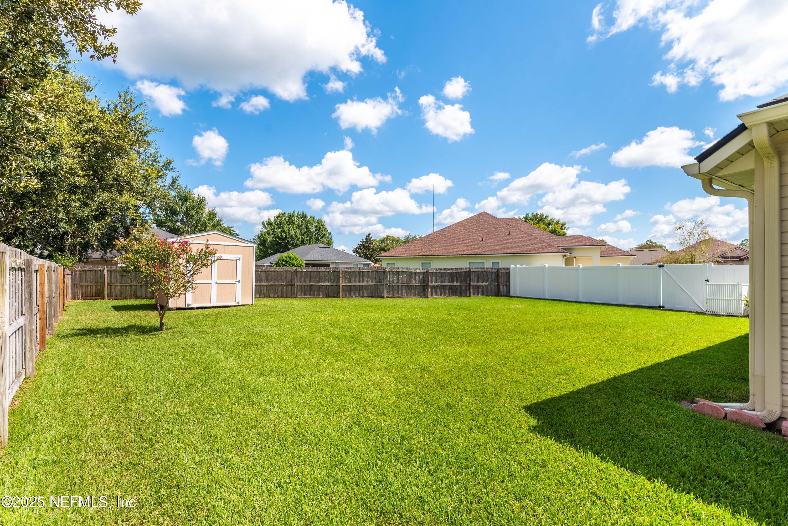 11798 Blueberry Lane Macclenny, FL 32063 - Photo 27 of 30 a view of a big yard with a swimming pool