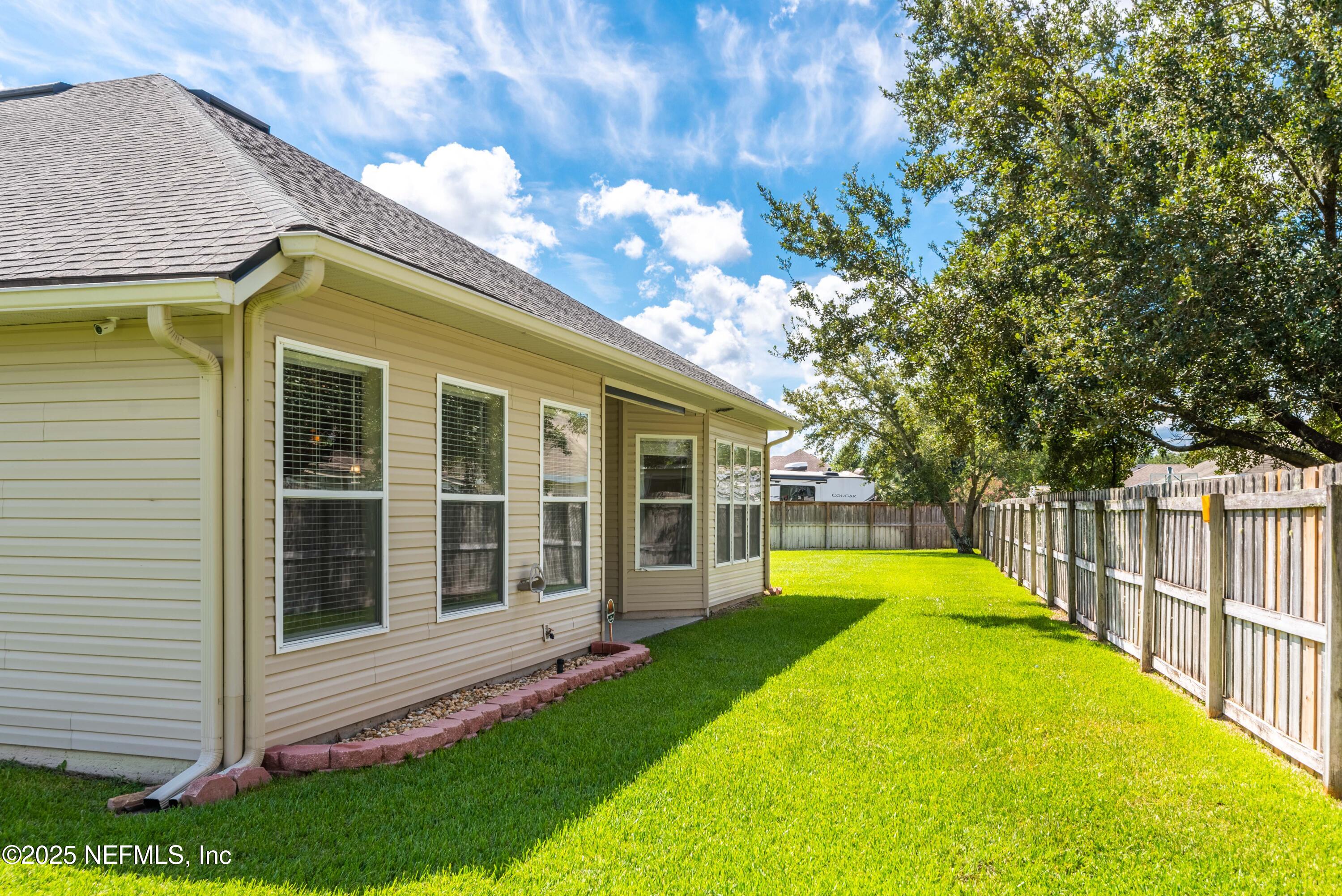 11798 Blueberry Lane Macclenny, FL 32063 - Photo 30 of 30 a view of a house with a backyard