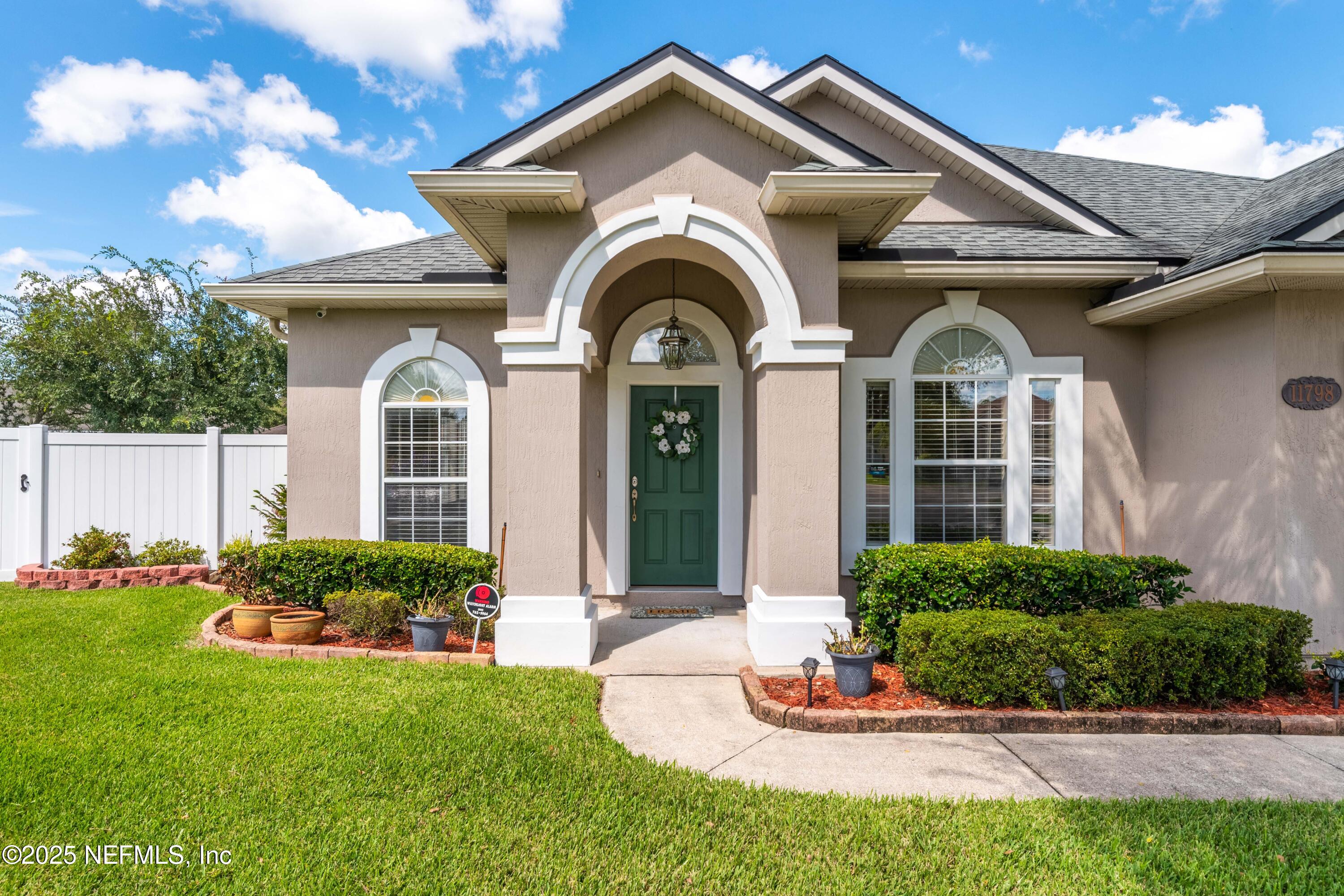 11798 Blueberry Lane Macclenny, FL 32063 - Photo 4 of 30 a front view of a house with a garden