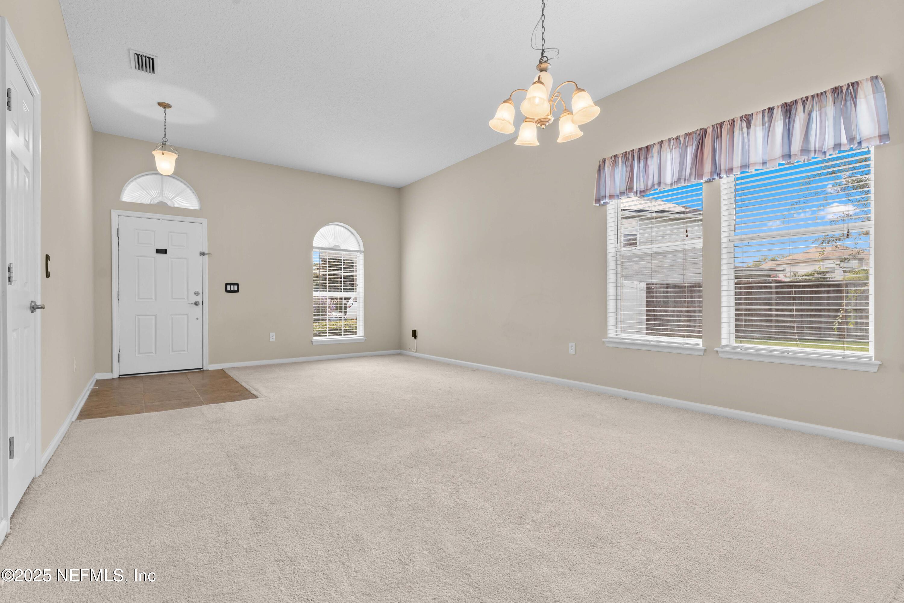 11798 Blueberry Lane Macclenny, FL 32063 - Photo 6 of 30 a view of an empty room with a window