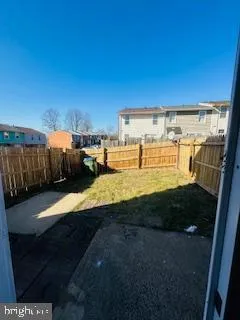 a view of a backyard of the house