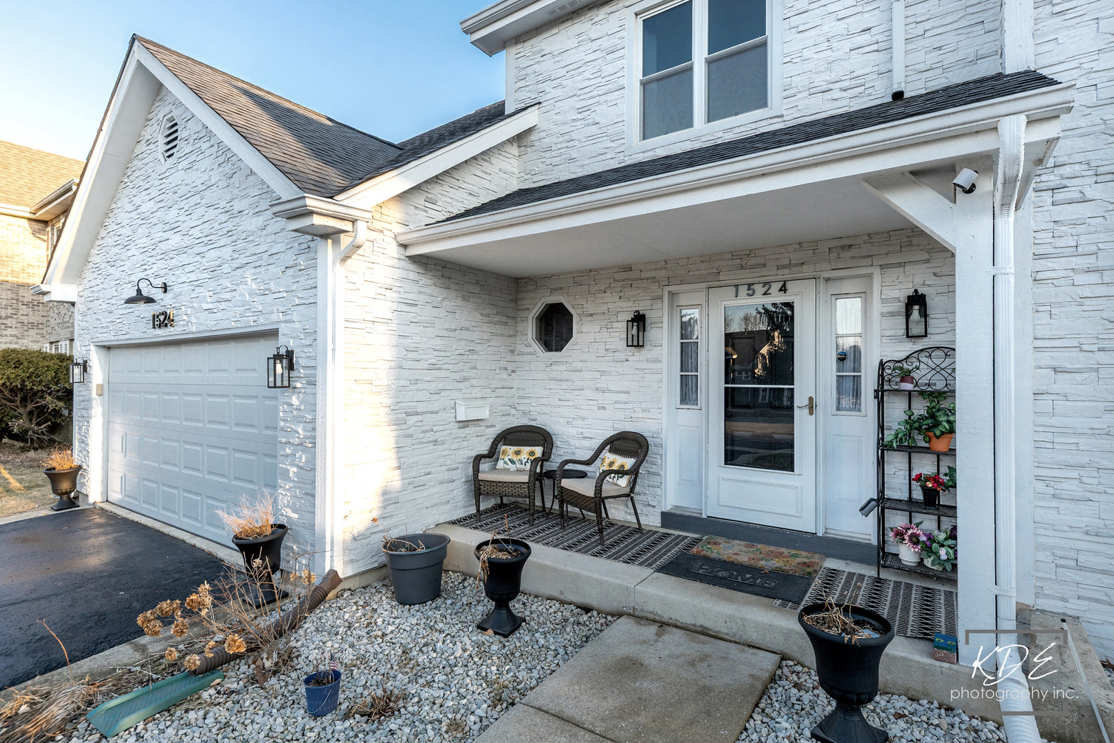 1524 Oswego Road Naperville, IL 60540 - Photo 3 of 40 a view of a patio with couches and potted plants
