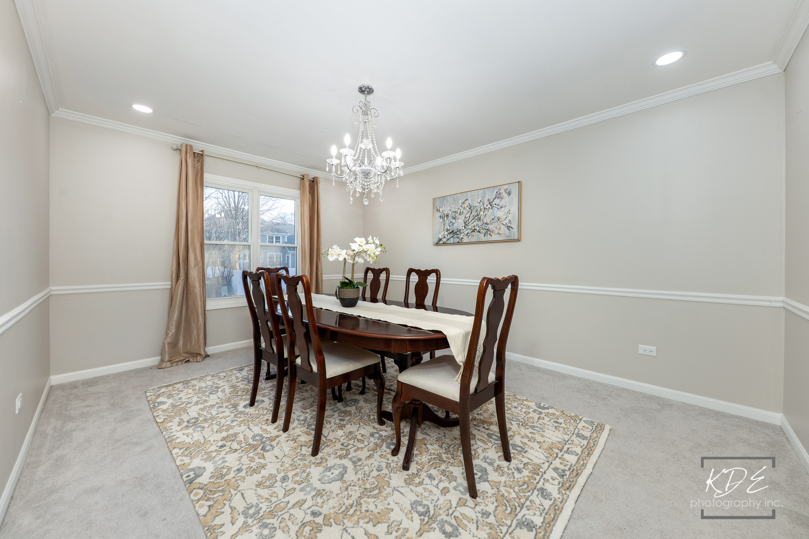 1524 Oswego Road Naperville, IL 60540 - Photo 8 of 40 a view of a dining room with furniture and chandelier