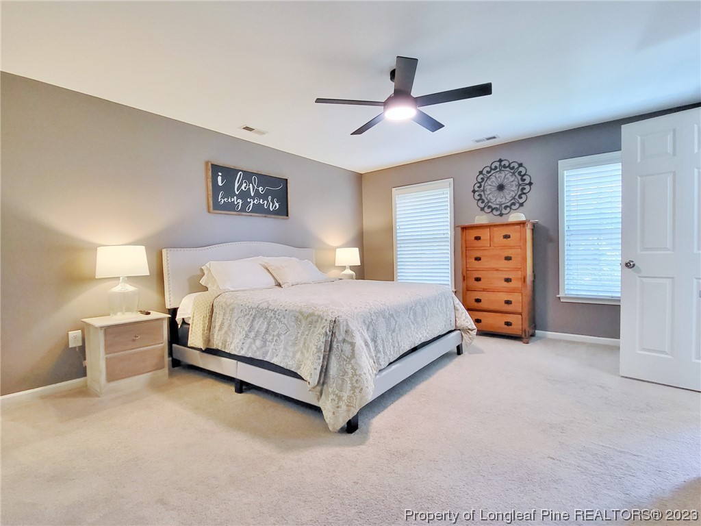 30 Bicentennial Way Cameron, NC 28326 - Photo 19 of 42 a bedroom with a bed and dresser