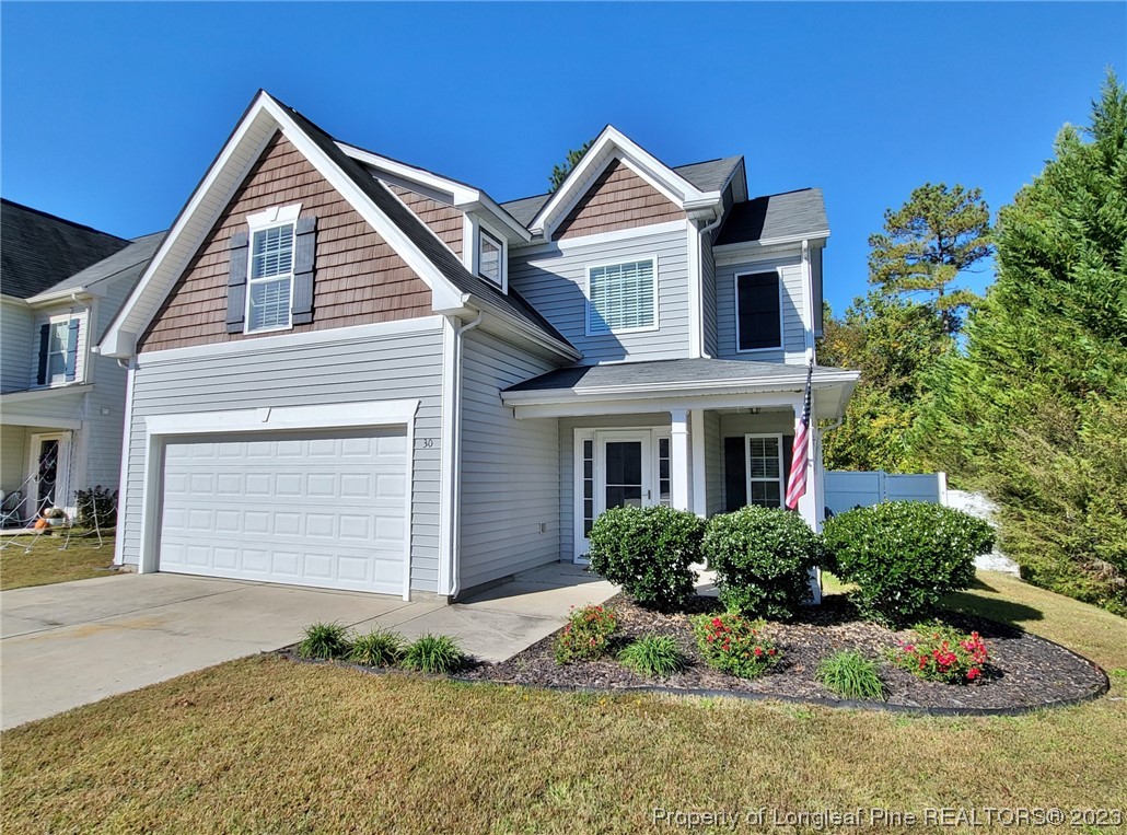 30 Bicentennial Way Cameron, NC 28326 - Photo 2 of 42 a front view of a house with a yard