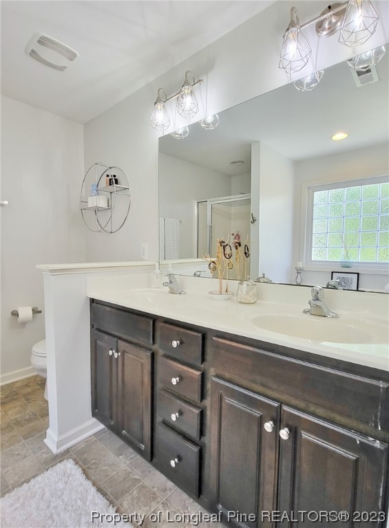 30 Bicentennial Way Cameron, NC 28326 - Photo 23 of 42 a bathroom with a double vanity sink and a mirror