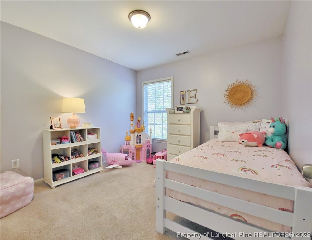 30 Bicentennial Way Cameron, NC 28326 - Photo 26 of 42 a bedroom with a bed and closet