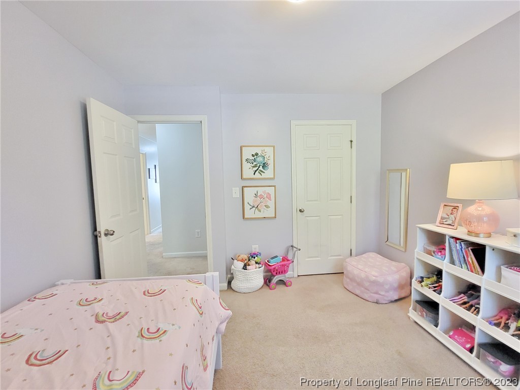 30 Bicentennial Way Cameron, NC 28326 - Photo 27 of 42 a bedroom with a bed and dresser