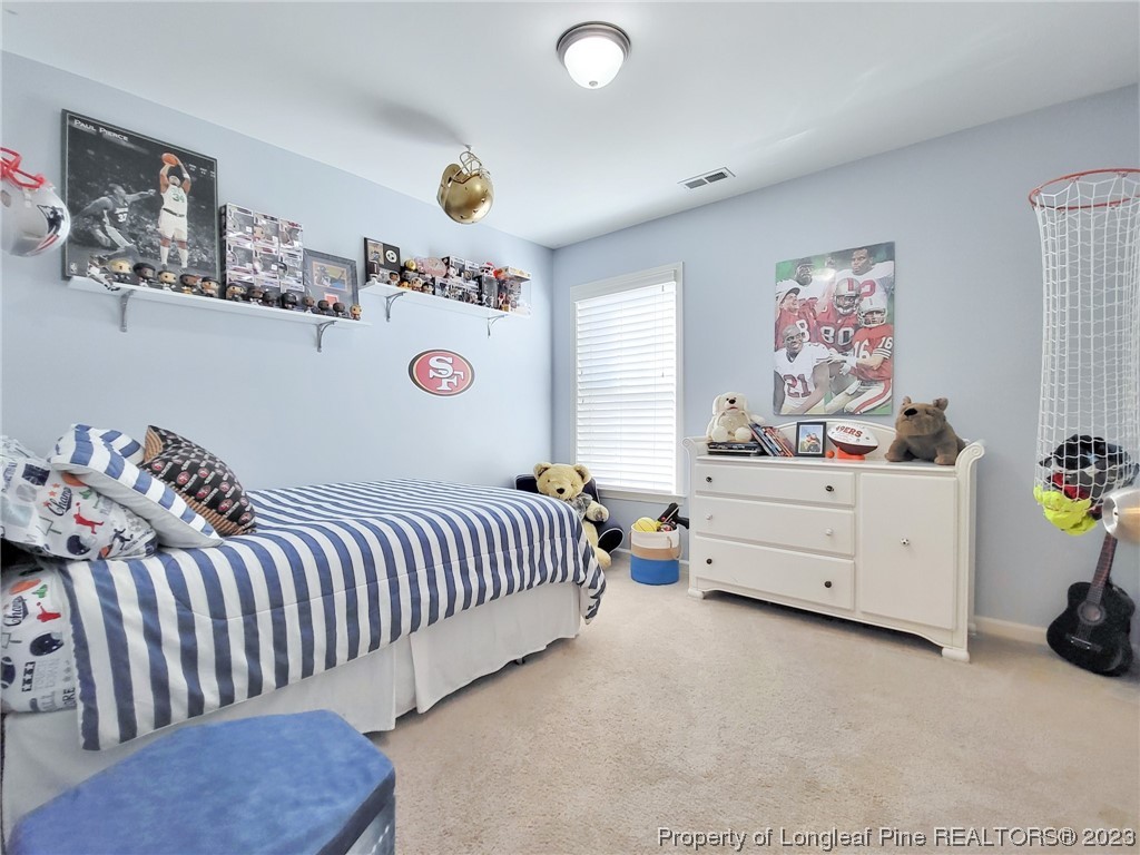 30 Bicentennial Way Cameron, NC 28326 - Photo 29 of 42 a bedroom with a bed and a window