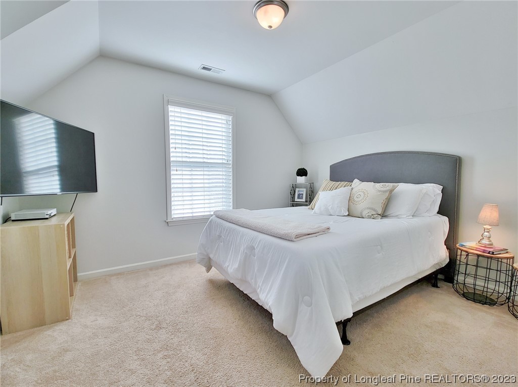 30 Bicentennial Way Cameron, NC 28326 - Photo 32 of 42 a bedroom with a bed and a window