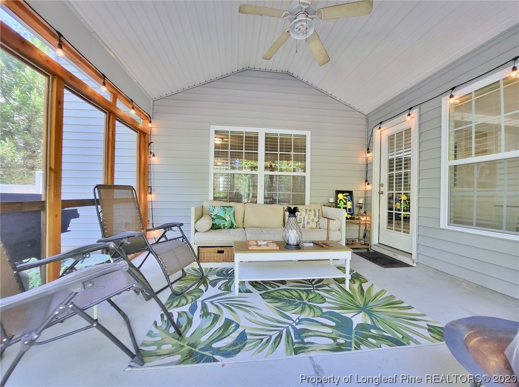 30 Bicentennial Way Cameron, NC 28326 - Photo 38 of 42 a living room with patio furniture and a large window