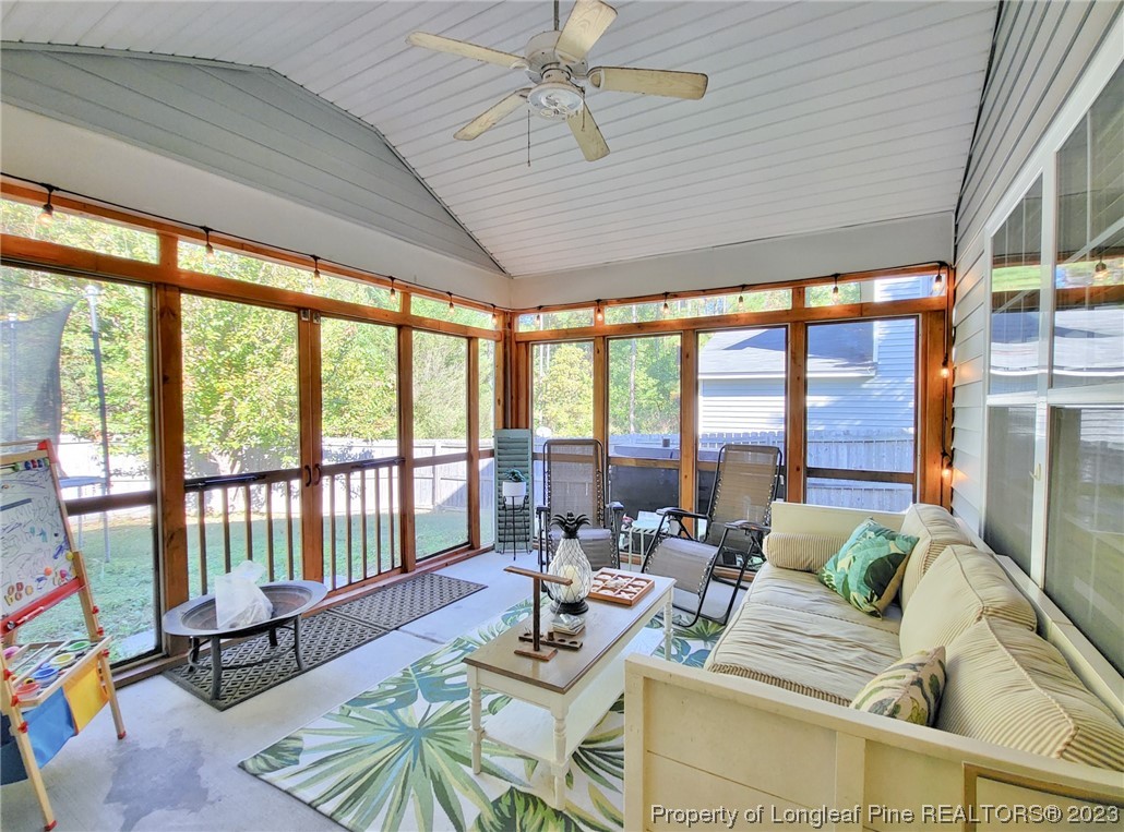 30 Bicentennial Way Cameron, NC 28326 - Photo 39 of 42 a living room with furniture and floor to ceiling windows