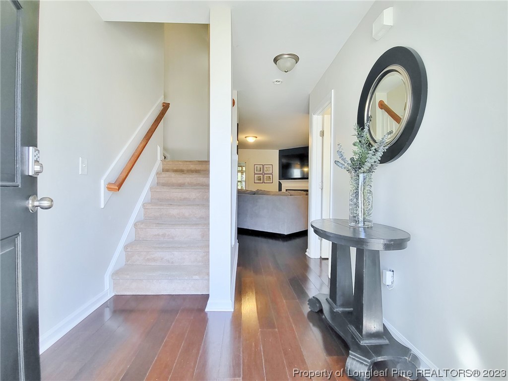 30 Bicentennial Way Cameron, NC 28326 - Photo 5 of 42 a view of a hallway with wooden floor and entryway